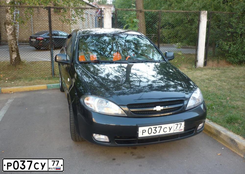 Фото автомобиля CHEVROLET LACETTI, 2011 — госномер Р090ОМ190. Цвет: ЧЕРНЫЙ