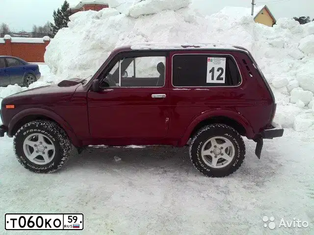 Фото автомобиля LADA 2121 NIVA, 1998 — госномер Т060КО59. Цвет: ТЕМНО-КРАСНЫЙ