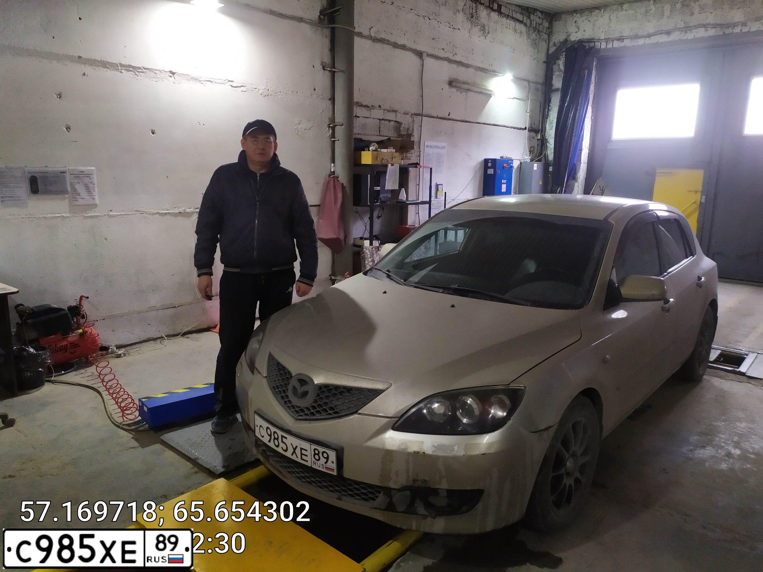 Фото автомобиля MAZDA 3, 2007 — госномер Р393РС72. Цвет: СЕРО-ЗОЛОТИСТЫЙ