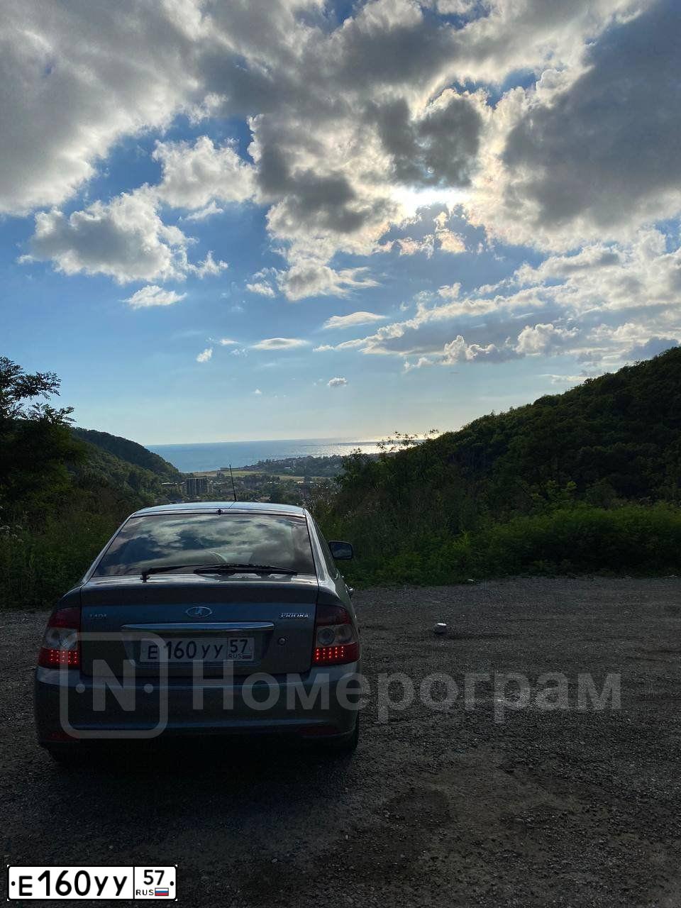 Фото автомобиля LADA 2172 PRIORA, 2011 — госномер Е160УУ57. Цвет: средний серо-зеленый металлик