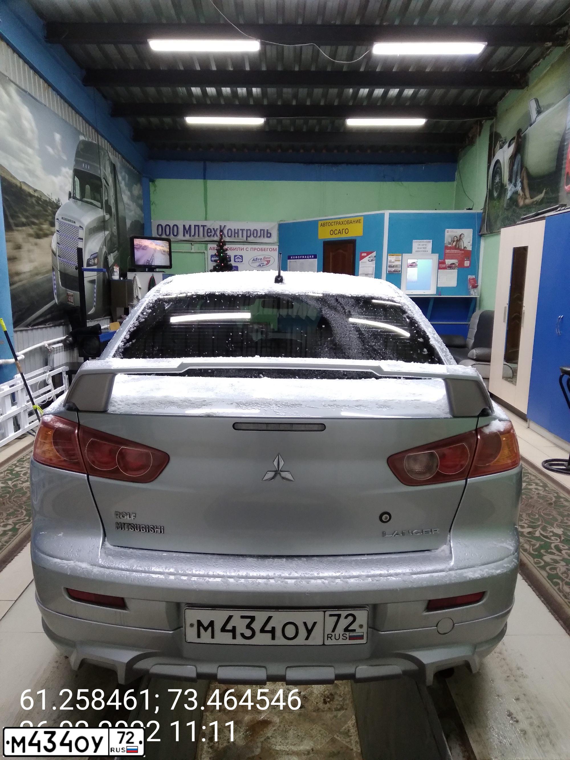 Фото автомобиля MITSUBISHI LANCER, 2009 — госномер Р200ХУ154. Цвет: Серебристый