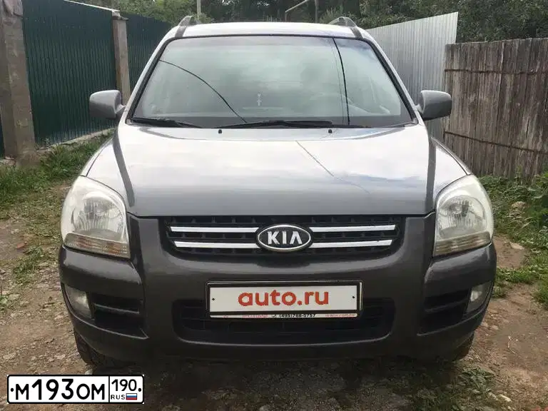 Фото автомобиля KIA SPORTAGE, 2006 — госномер Т794РК31. Цвет: СЕРЫЙ