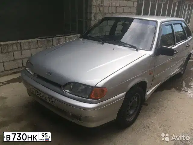 Фото автомобиля LADA 2114 SAMARA, 2005 — госномер Е100РН05. Цвет: СЕРЕБРИСТ
