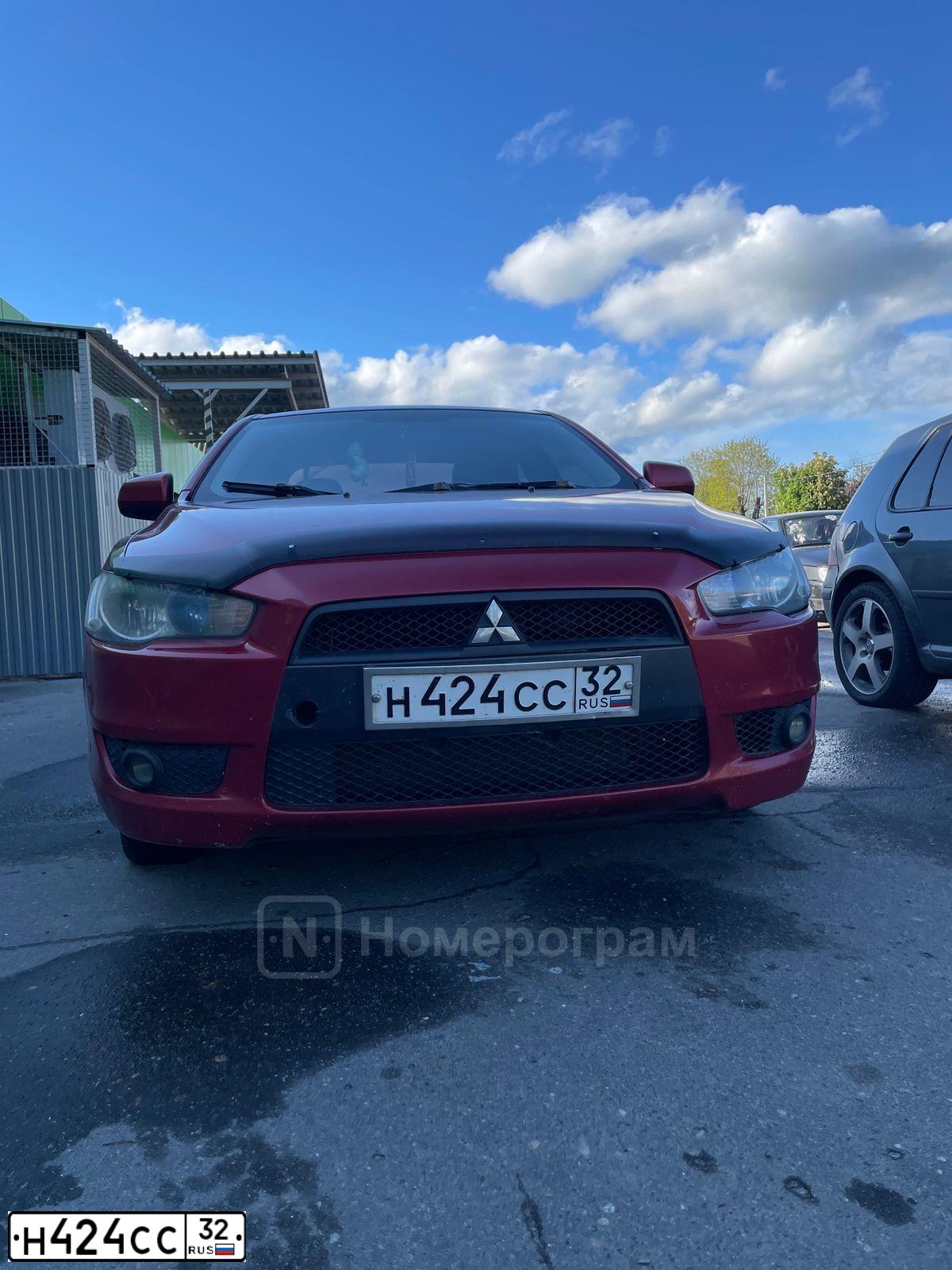 Фото автомобиля MITSUBISHI LANCER, 2007 — госномер Н424СС32. Цвет: Красный