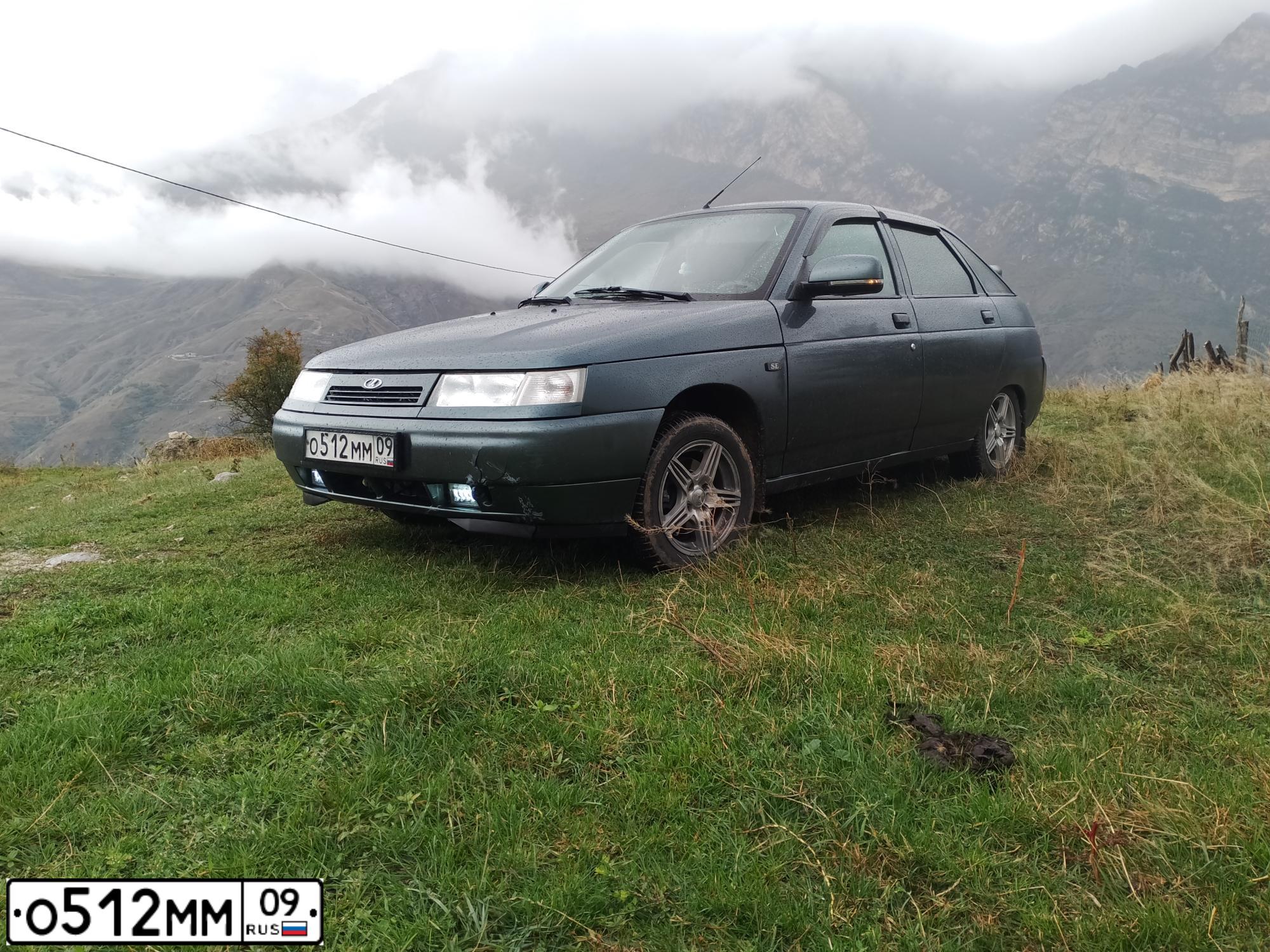 Фото автомобиля LADA 2112, 2006 — госномер О512ММ09. Цвет: СЕРО-СИНЕ-ЗЕЛЕНЫЙ