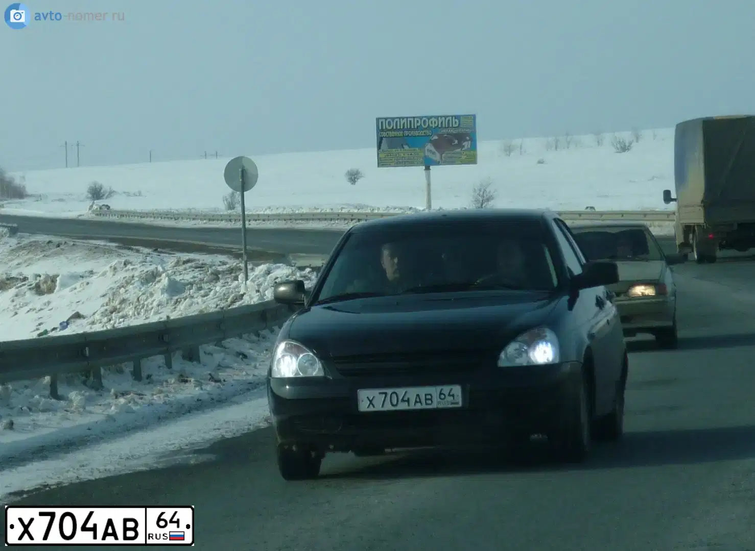 Фото автомобиля LADA 2172 PRIORA, 2010 — госномер Х704АВ64. Цвет: СИНЕ-ЧЕРНЫЙ