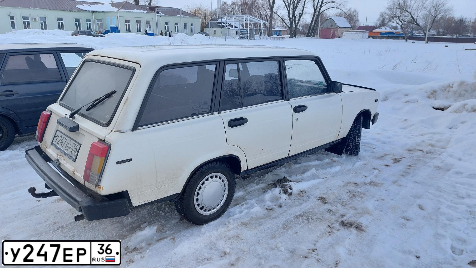 Фото автомобиля VAZ 2104 LADA, 1998 — госномер К777УМ77. Цвет: СЕРО-БЕЛЫЙ