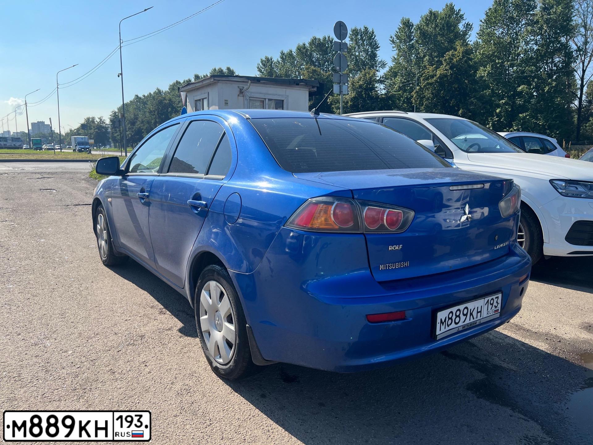 Фото автомобиля MITSUBISHI LANCER, 2010 — госномер Х154СН71. Цвет: синий
