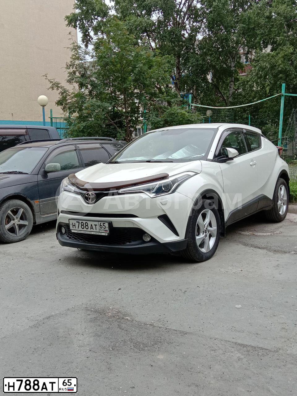 Фото автомобиля ТОЙОТА C-HR, 2018 — госномер В206РН797. Цвет: Белый