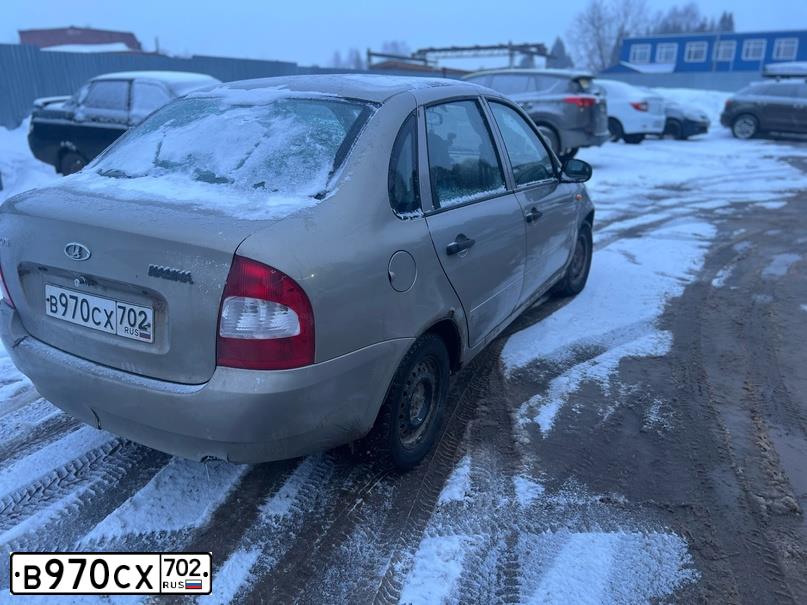 Фото автомобиля LADA 1118 KALINA, 2006 — госномер В970СХ702. Цвет: БЕЖЕВО-СЕРЫЙ