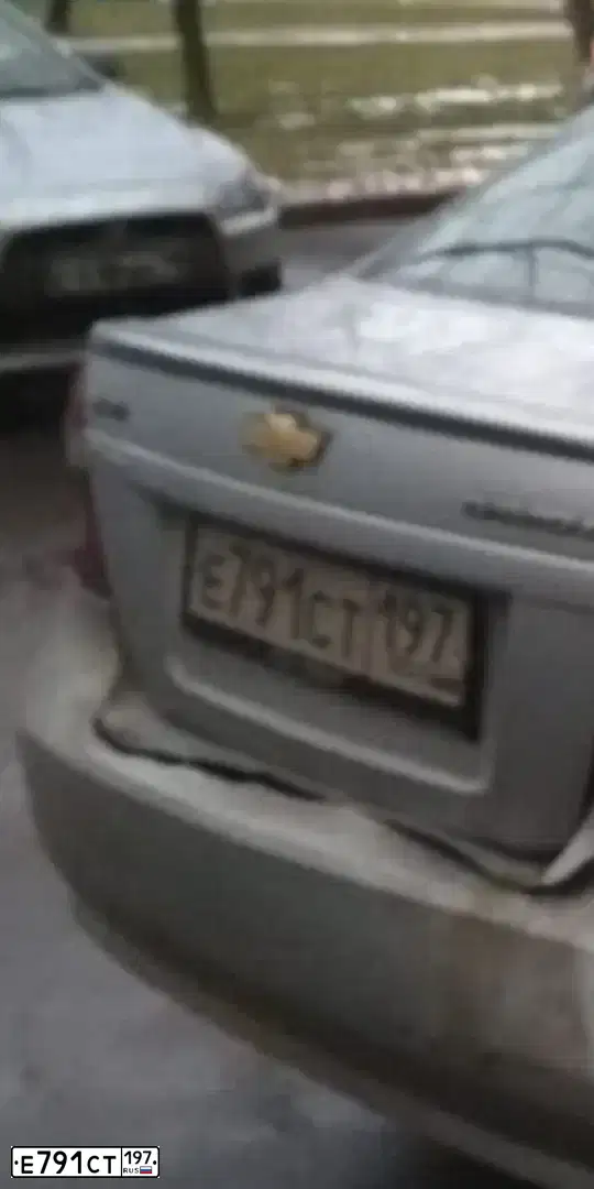 Фото автомобиля CHEVROLET AVEO, 2009 — госномер Е791СТ197. Цвет: СЕРЫЙ
