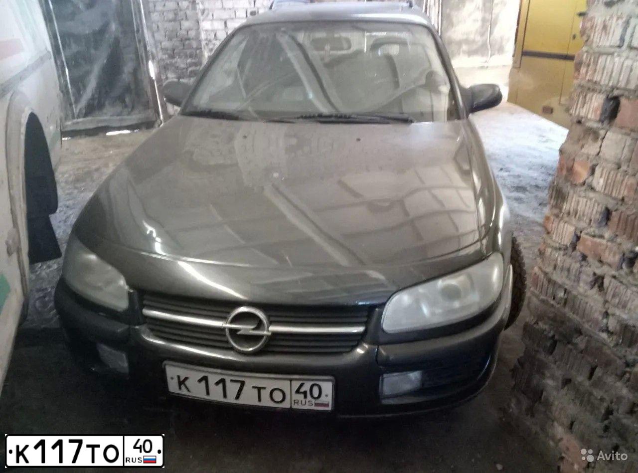 Фото автомобиля OPEL OMEGA, 1997 — госномер О101ТУ31. Цвет: ЧЕРНЫЙ