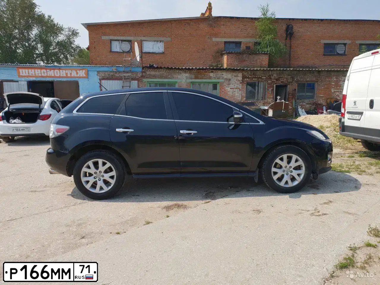 Фото автомобиля OPEL ASTRA, 2013 — госномер Р166ММ71. Цвет: Белый