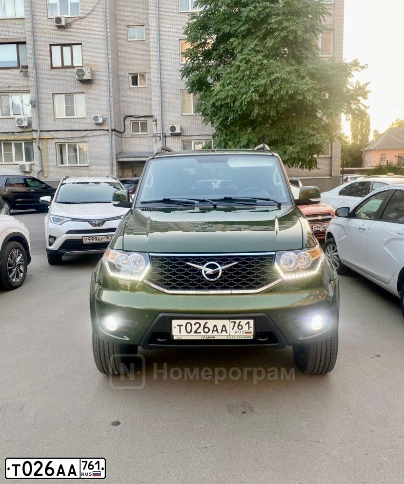 Фото автомобиля UAZ 3163 PATRIOT, 2019 — госномер Т026АА761. Цвет: ЗЕЛЕНЫЙ МЕТАЛЛИК