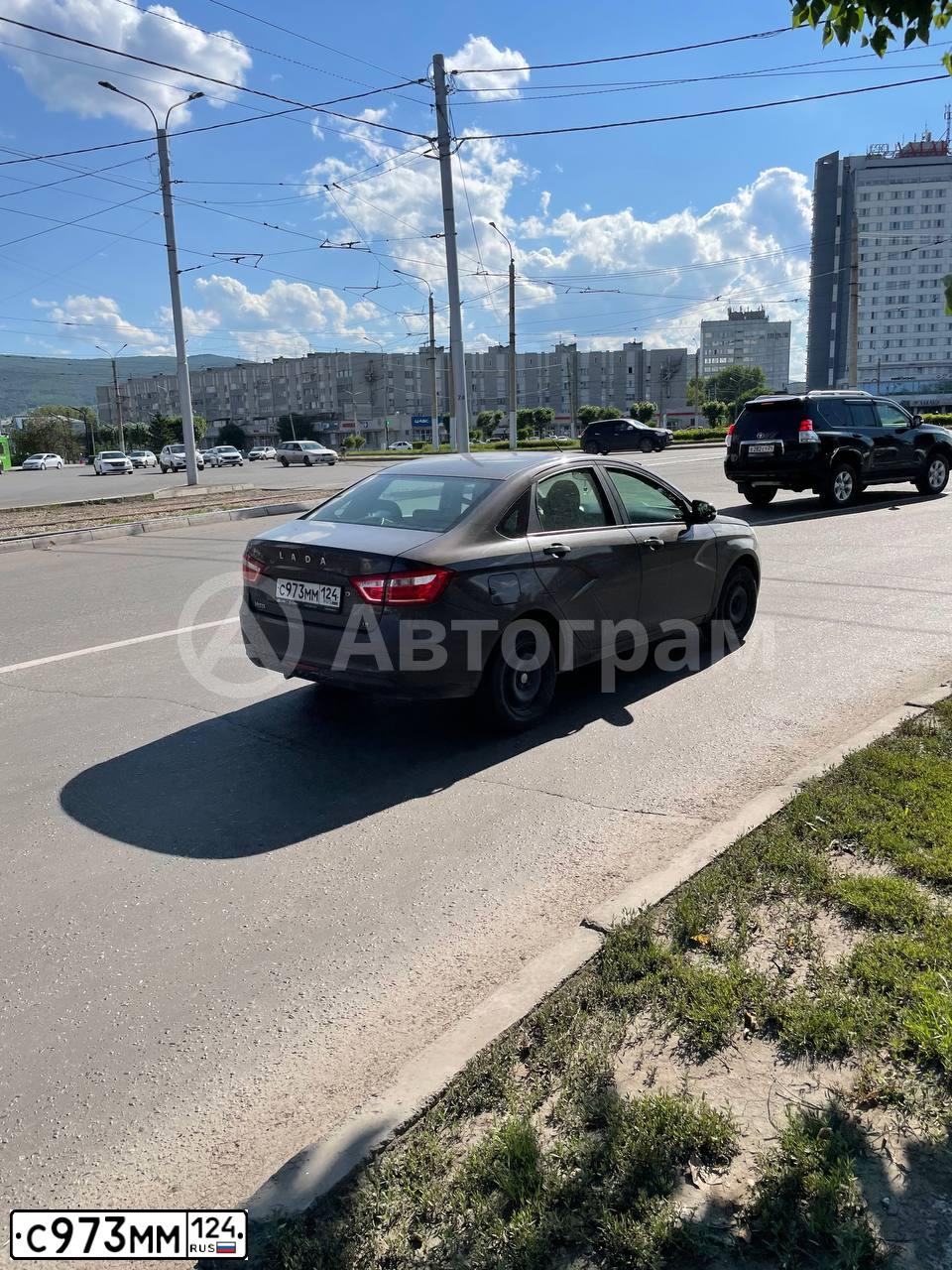 Фото автомобиля LADA VESTA, 2016 — госномер К854УА124. Цвет: Коричневый