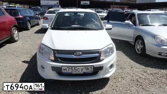Фото автомобиля RENAULT MEGANE, 2009 — госномер Т694ОА161. Цвет: БЕЛЫЙ