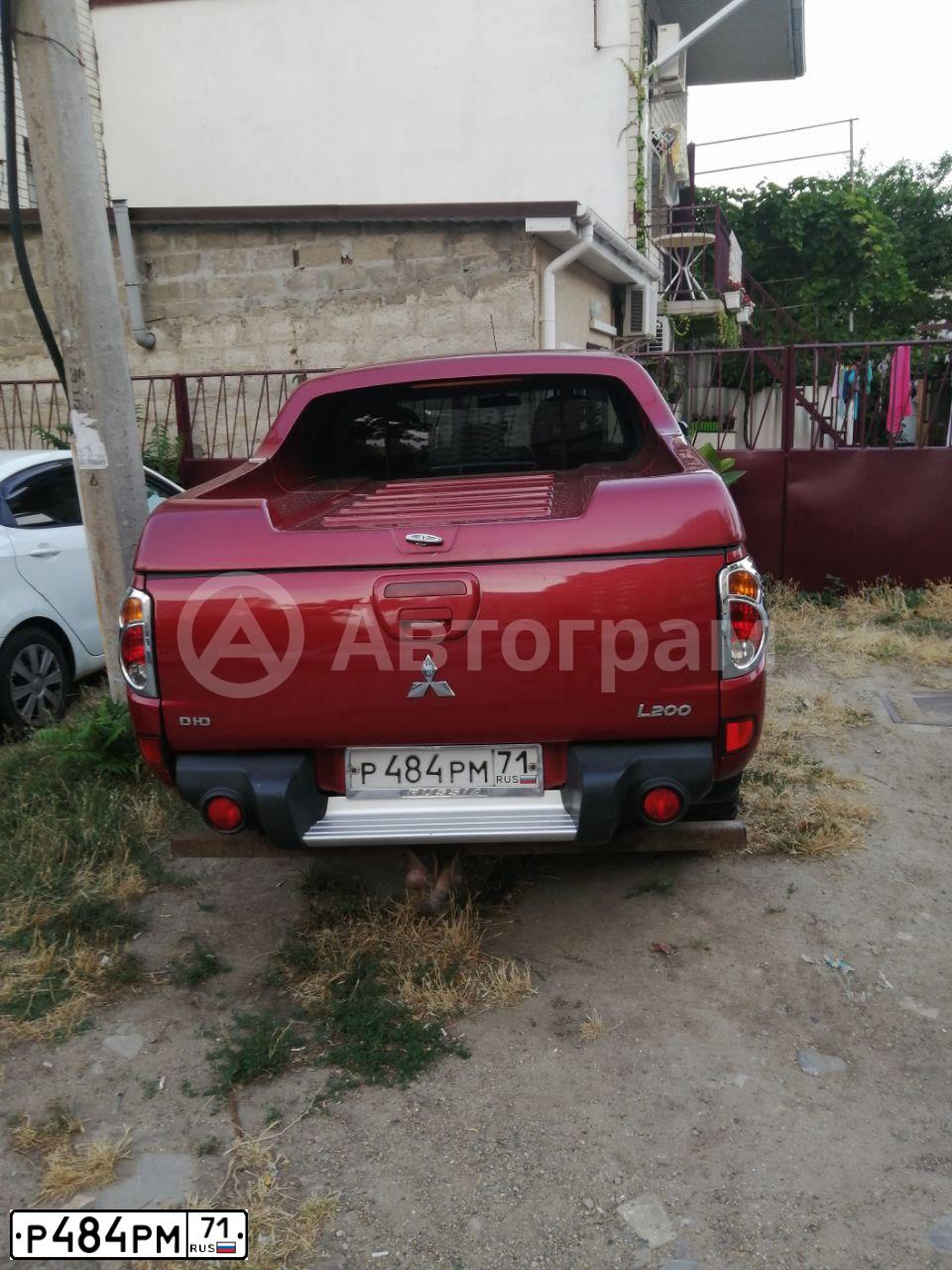 Фото автомобиля MITSUBISHI L 200, 2007 — госномер Р506ТХ198. Цвет: КРАСНЫЙ