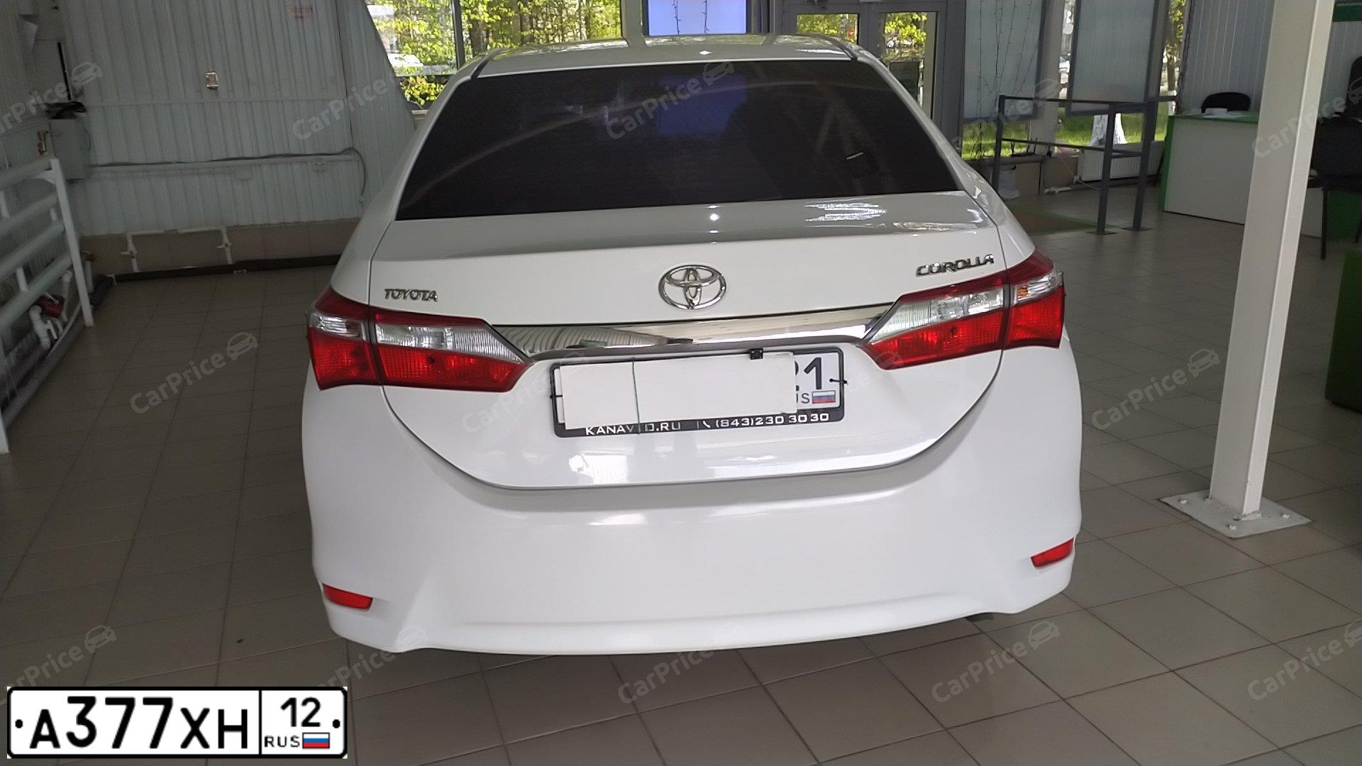 Фото автомобиля TOYOTA COROLLA, 2014 — госномер Е548КМ774. Цвет: Белый