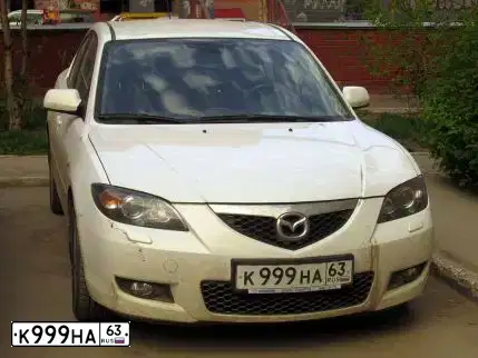 Фото автомобиля MAZDA 3, 2007 — госномер Е095ОО21. Цвет: БЕЛЫЙ