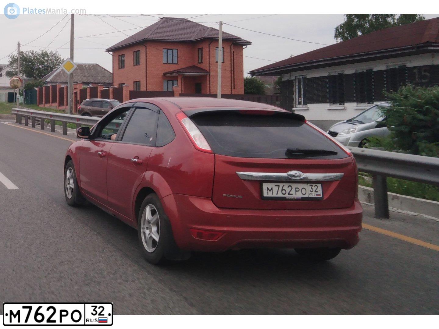 Фото автомобиля FORD FOCUS, 2008 — госномер Р976НТ67. Цвет: КРАСНО-ОРАНЖЕВЫЙ