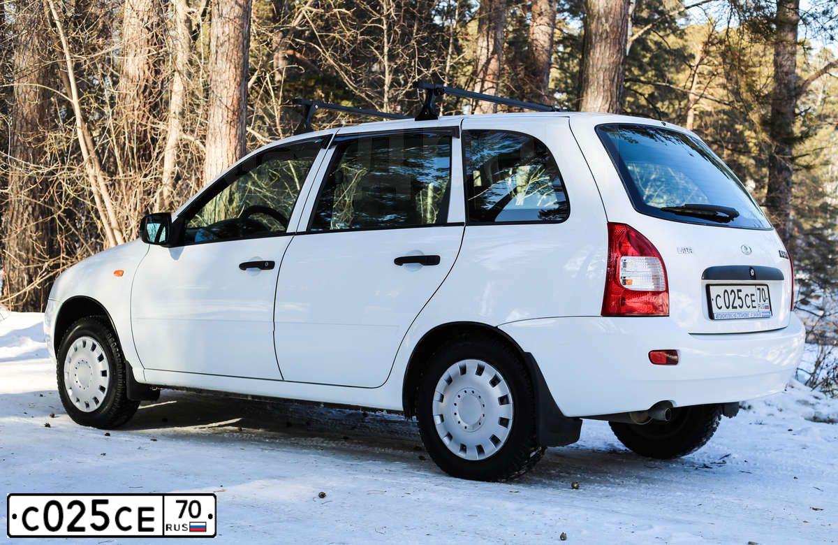 Фото автомобиля LADA 1117 KALINA, 2009 — госномер С025СЕ70. Цвет: БЕЛЫЙ