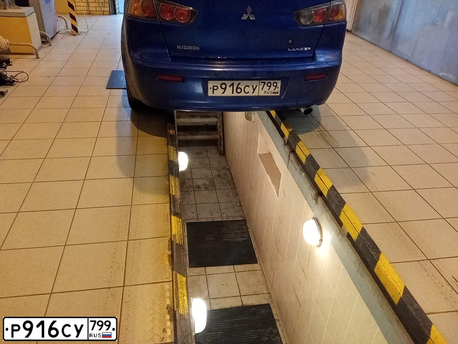 Фото автомобиля MITSUBISHI LANCER, 2011 — госномер Т409РС750. Цвет: синий