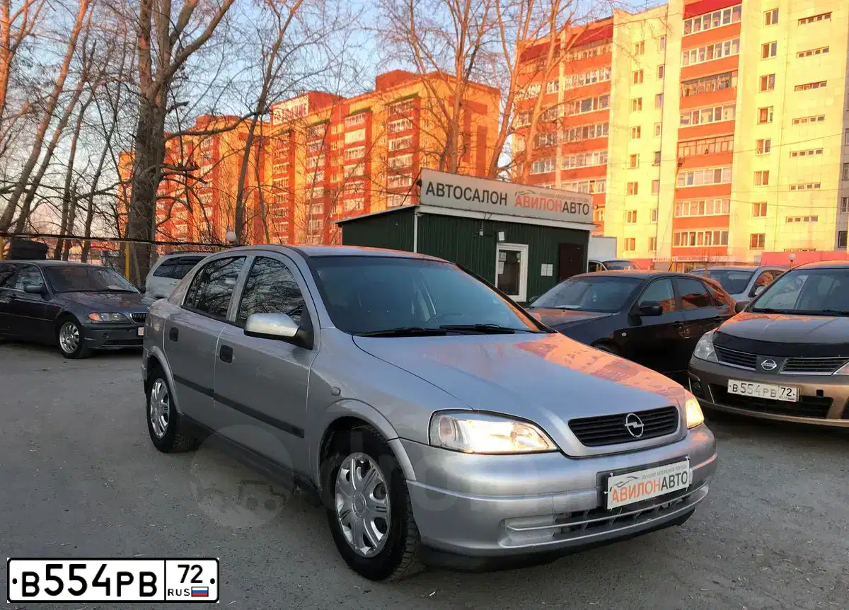 Фото автомобиля NISSAN TIIDA, 2008 — госномер В554РВ72. Цвет: БРОНЗОВЫЙ