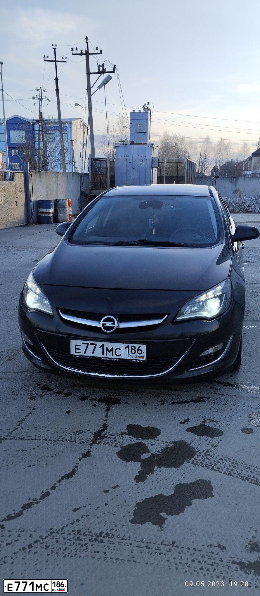 Фото автомобиля OPEL ASTRA, 2012 — госномер Х718РК72. Цвет: ЧЕРНЫЙ МЕТАЛЛИК