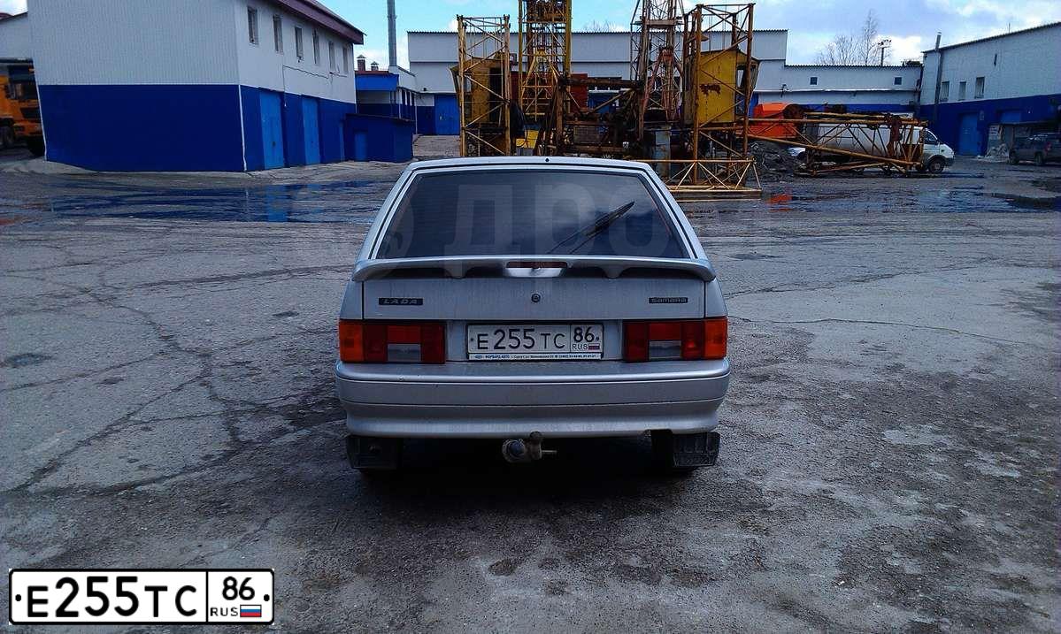 Фото автомобиля LADA 2114 SAMARA, 2009 — госномер Е035КХ702. Цвет: Светло-Серебристый металлик