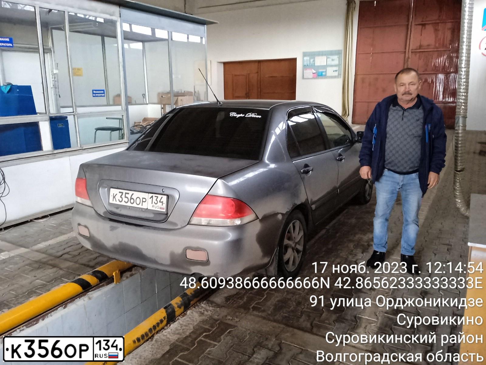 Фото автомобиля MITSUBISHI LANCER, 2004 — госномер К356ОР134. Цвет: Серый