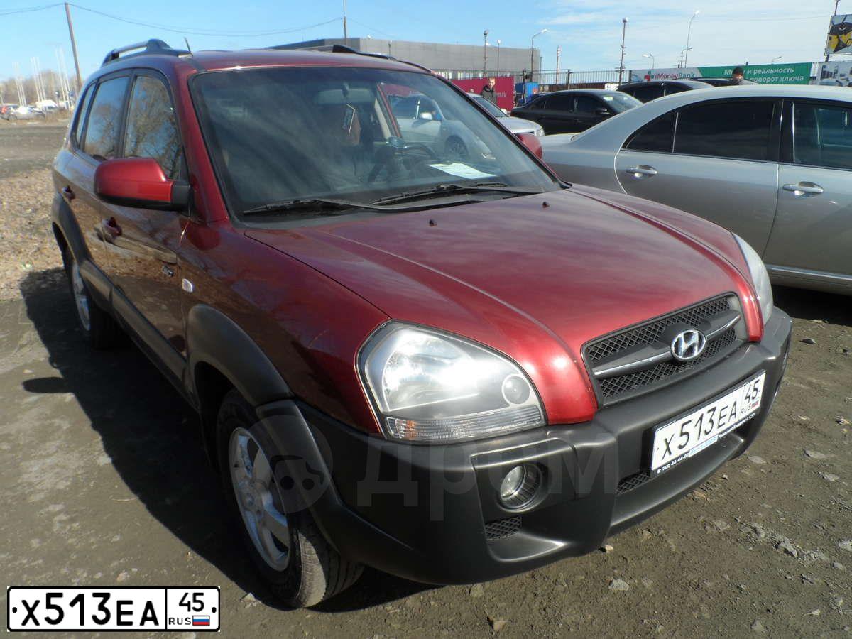 Фото автомобиля HYUNDAI TUCSON, 2006 — госномер С755РР70. Цвет: ТЕМНО-КРАСНЫЙ