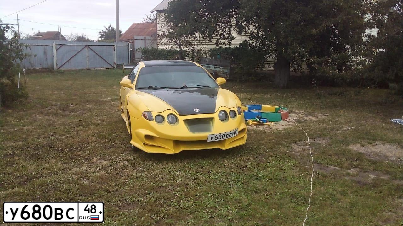 Фото автомобиля HYUNDAI TIBURON, 1999. Цвет: ЖЁЛТЫЙ