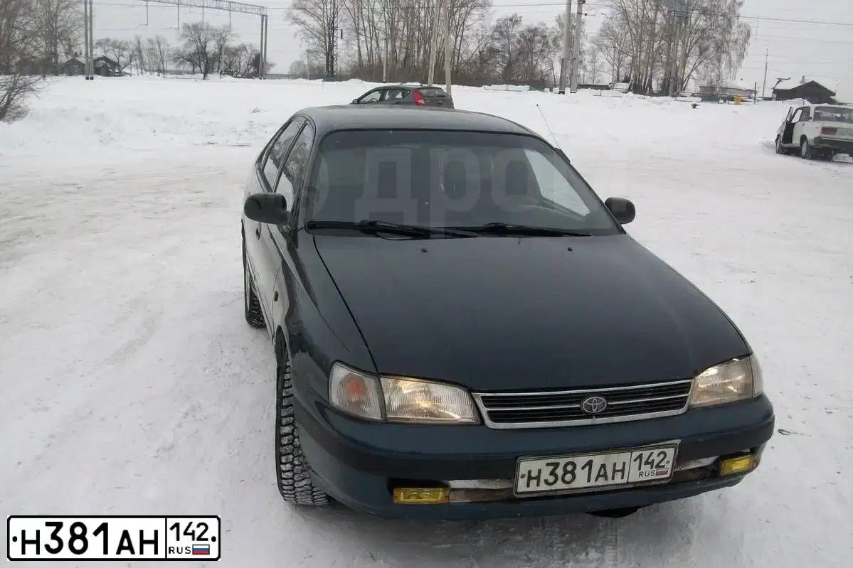 Фото автомобиля TOYOTA CARINA, 1993 — госномер А515ХХ90. Цвет: ЗЕЛЕНЫЙ