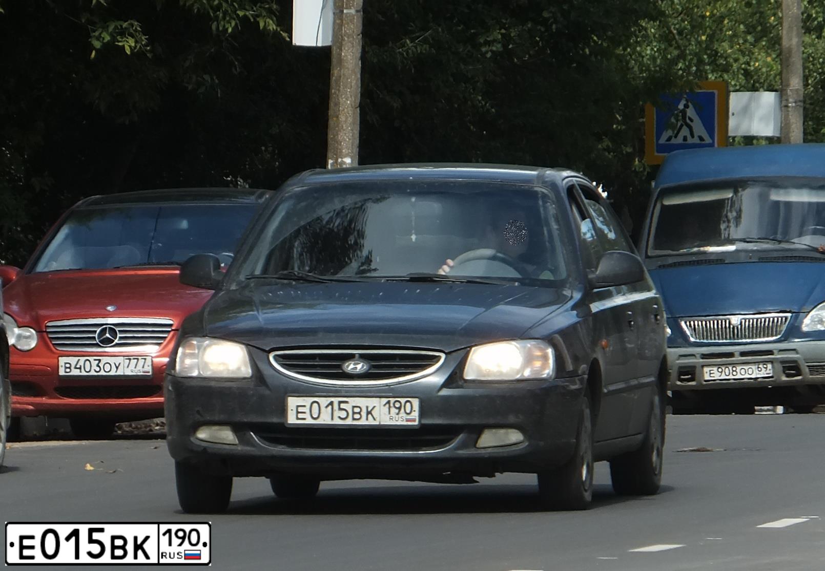 Фото автомобиля TAGAZ ACCENT, 2008 — госномер Е015ВК190. Цвет: ЧЕРНЫЙ