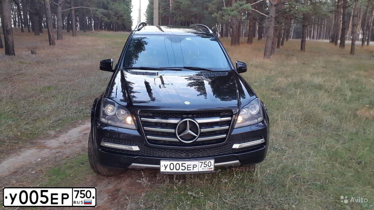 Фото автомобиля TOYOTA LANDCRUISER, 2005 — госномер У005ЕР750. Цвет: СЕРЕБРИСТЫЙ
