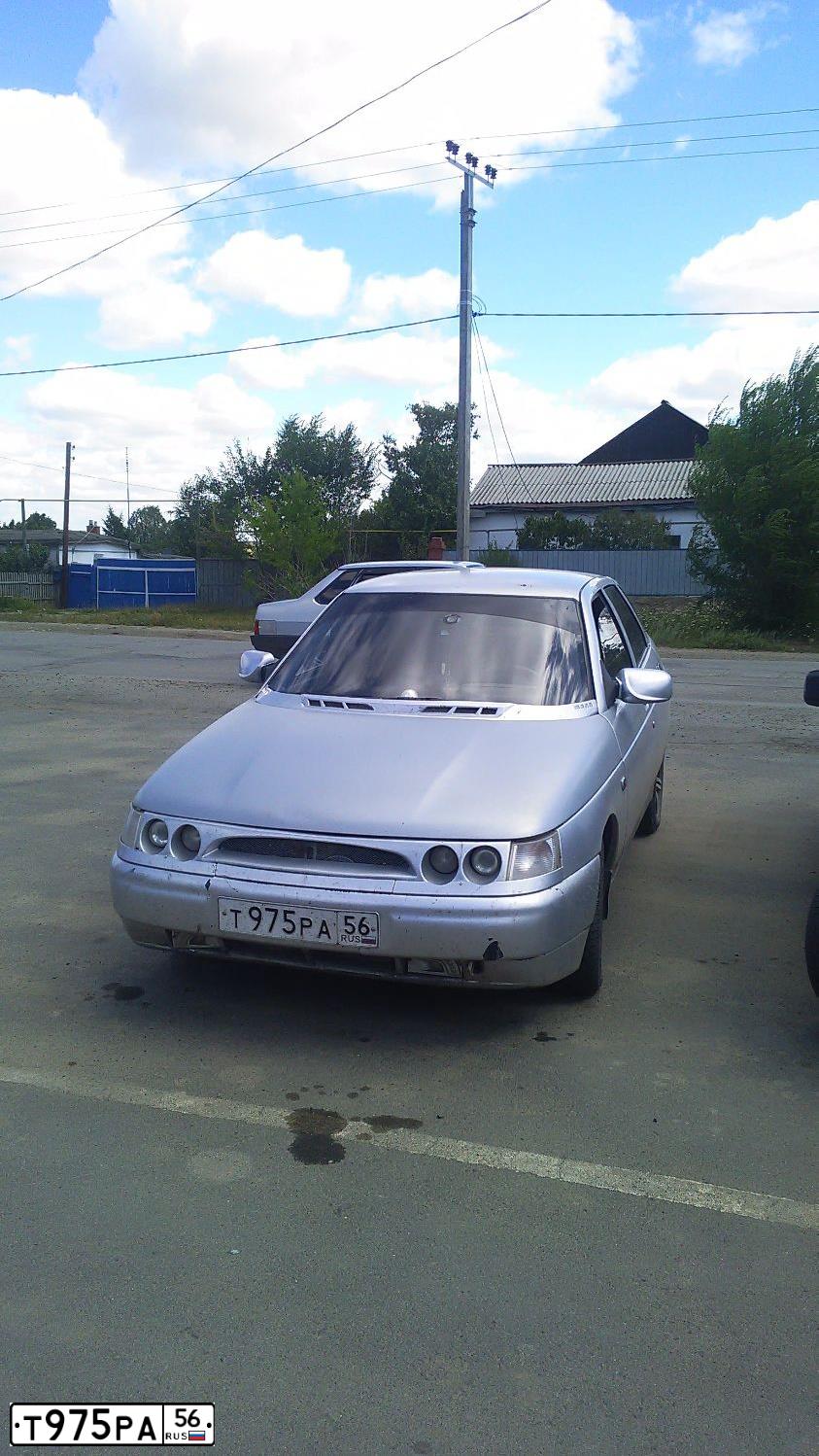 Фото автомобиля LADA 2112, 2005 — госномер Т975РА56. Цвет: Светло-серебристый металик