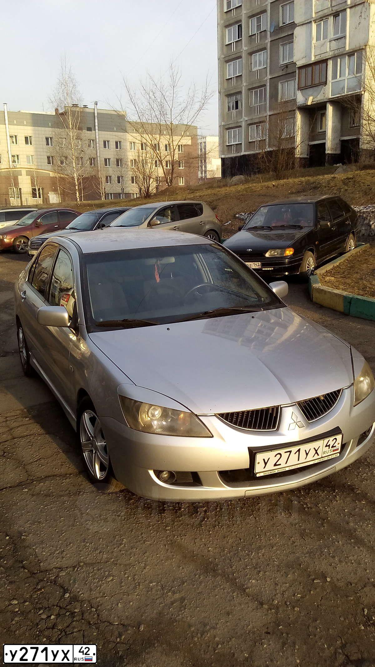 Фото автомобиля MITSUBISHI LANCER, 2004 — госномер С992НО142. Цвет: СЕРЕБРИСТЫЙ
