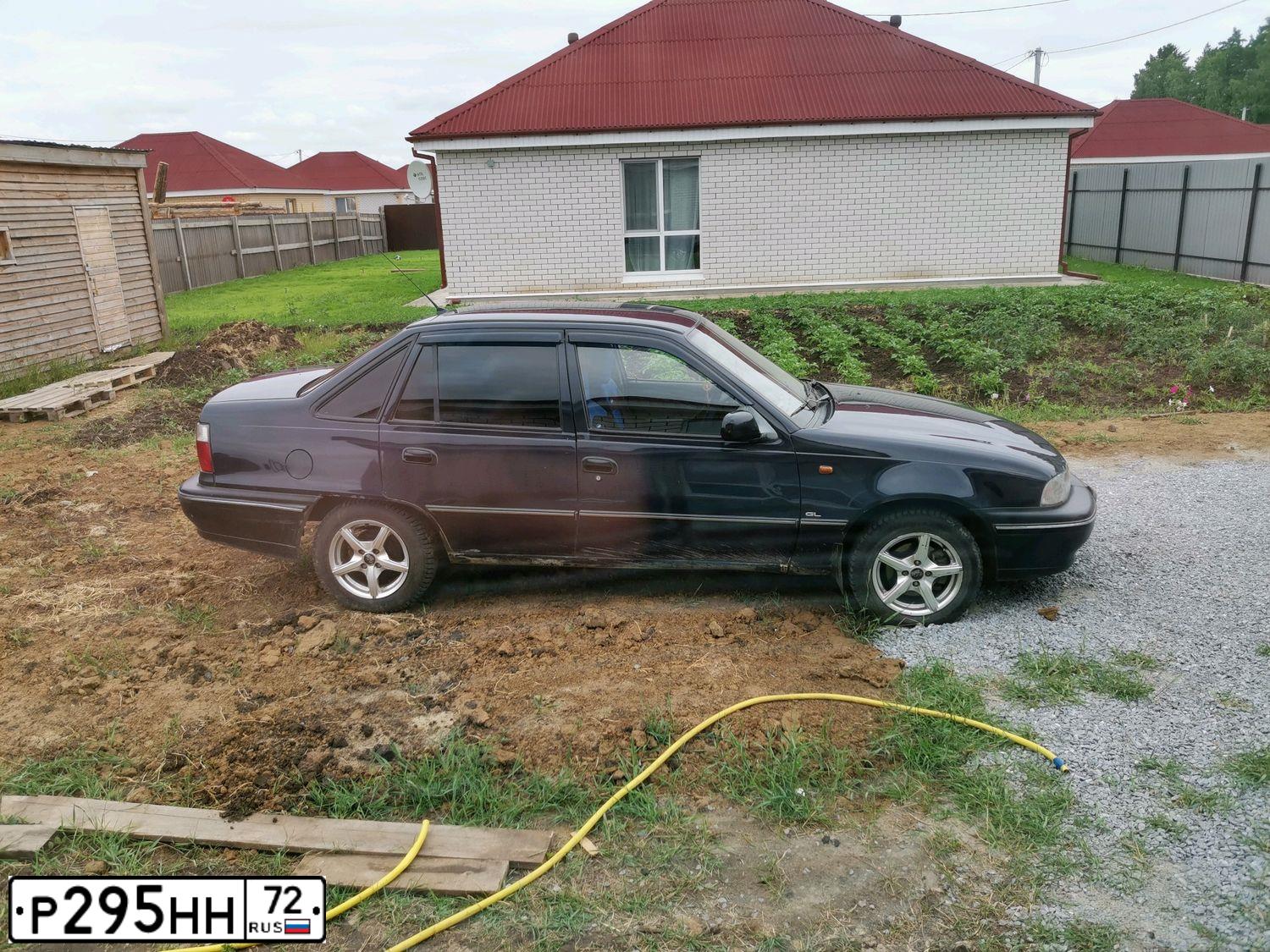 Фото автомобиля DAEWOO NEXIA, 2007 — госномер Р295НН72. Цвет: ЧЕРНО-СИНИЙ