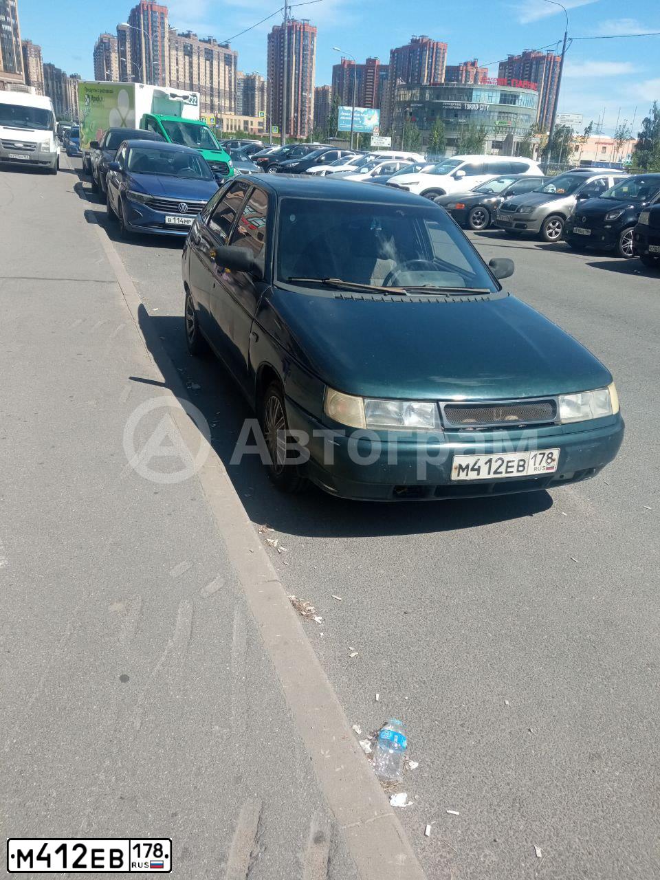 Фото автомобиля LADA 2112, 2002 — госномер М412ЕВ178. Цвет: ТЕМНО-ЗЕЛЕНЫЙ