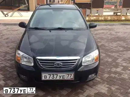 Фото автомобиля KIA CERATO, 2008 — госномер Р610АВ154. Цвет: ЧЕРНЫЙ