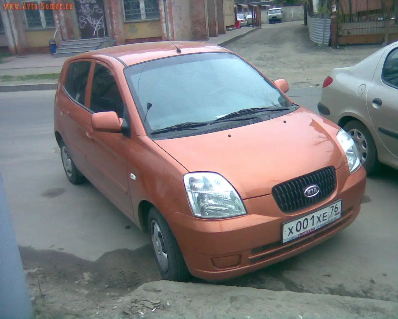 Фото автомобиля KIA SPORTAGE, 2011 — госномер Х001ХЕ76. Цвет: Белый