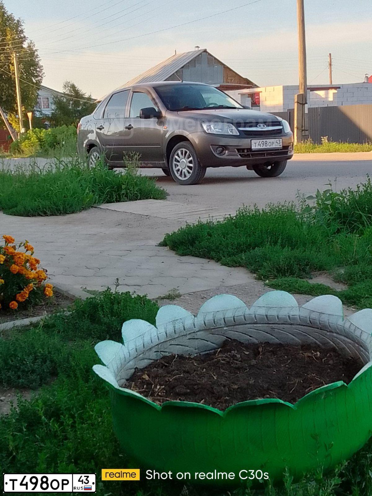 Фото автомобиля LADA 2190 GRANTA, 2014 — госномер Т498ОР43. Цвет: ЗОЛОТИСТО-КОРИЧНЕВЫЙ