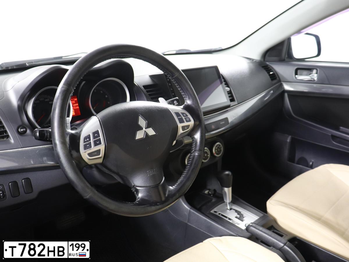 Фото автомобиля MITSUBISHI LANCER, 2008 — госномер Т782НВ199. Цвет: синий