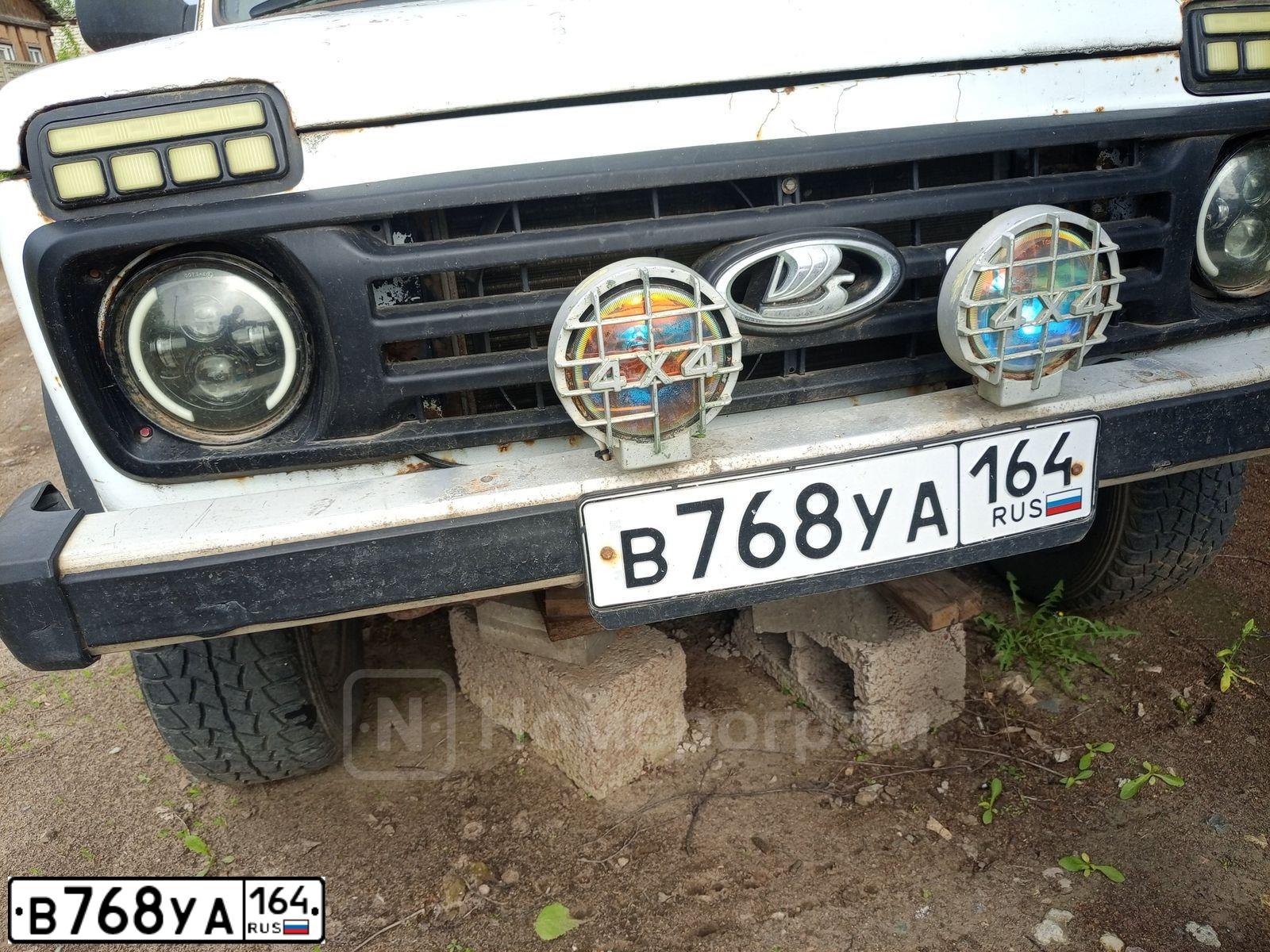 Фото автомобиля LADA 2121 NIVA, 1999 — госномер В768УА164. Цвет: Белый