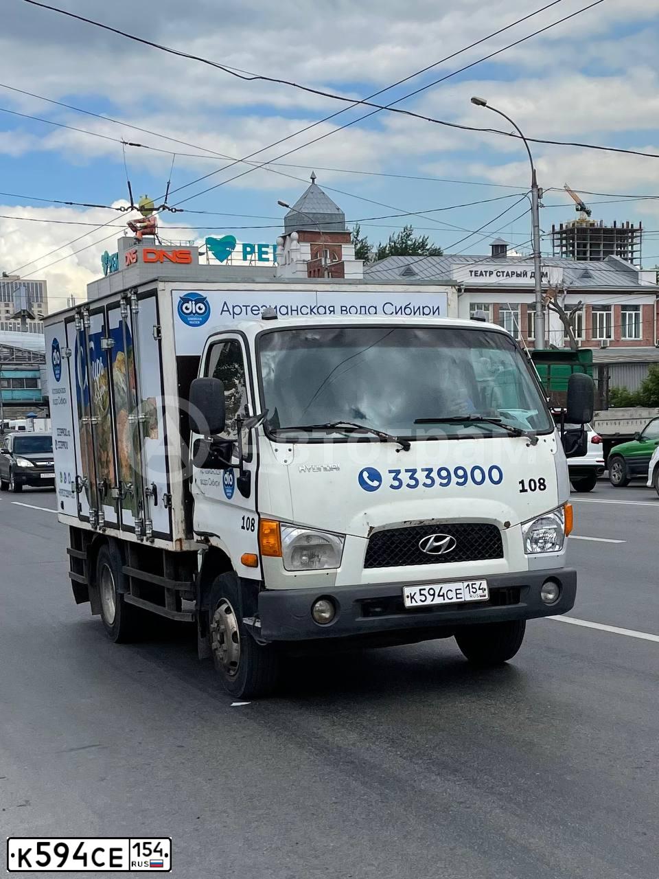 Фото автомобиля HYUNDAI MIGHTY, 2009 — госномер К594СЕ154. Цвет: Белый