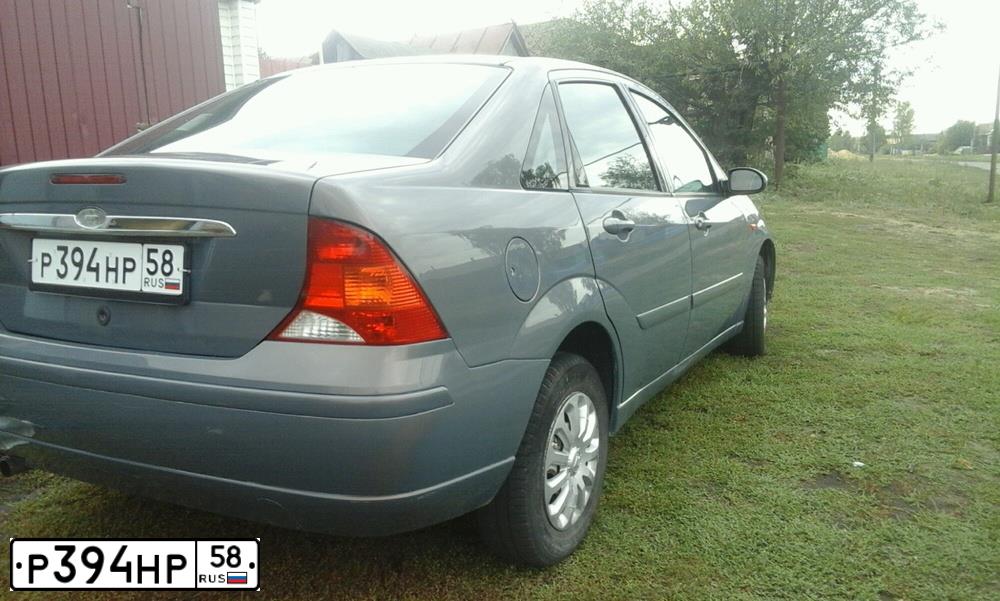 Фото автомобиля FORD FOCUS, 2004 — госномер Р394НР58. Цвет: СЕРО-ЗОЛОТИСТЫЙ