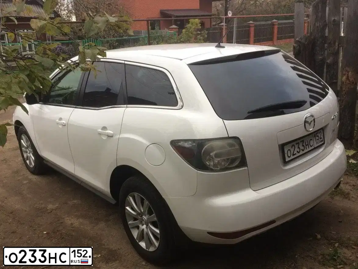 Фото автомобиля MAZDA CX-7, 2011 — госномер О233НС152. Цвет: Белый