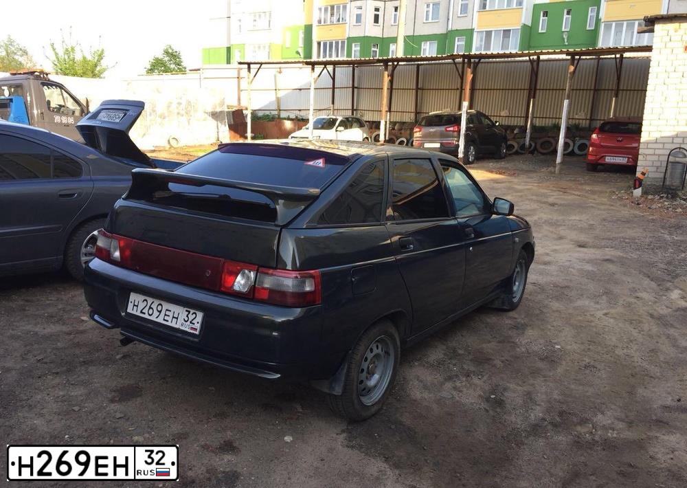 Фото автомобиля LADA 2112, 2006 — госномер Н269ЕН32. Цвет: ЗОЛОТИСТО ТЕМНО-ЗЕЛЕНЫЙ