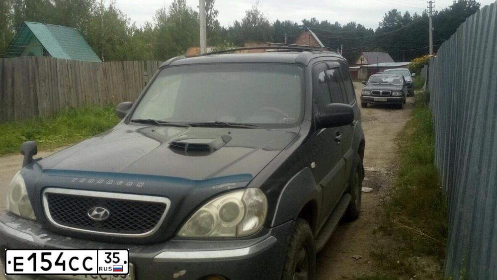 Фото автомобиля HYUNDAI TERRACAN, 2003 — госномер Н111ЕН29. Цвет: ЧЕРНЫЙ