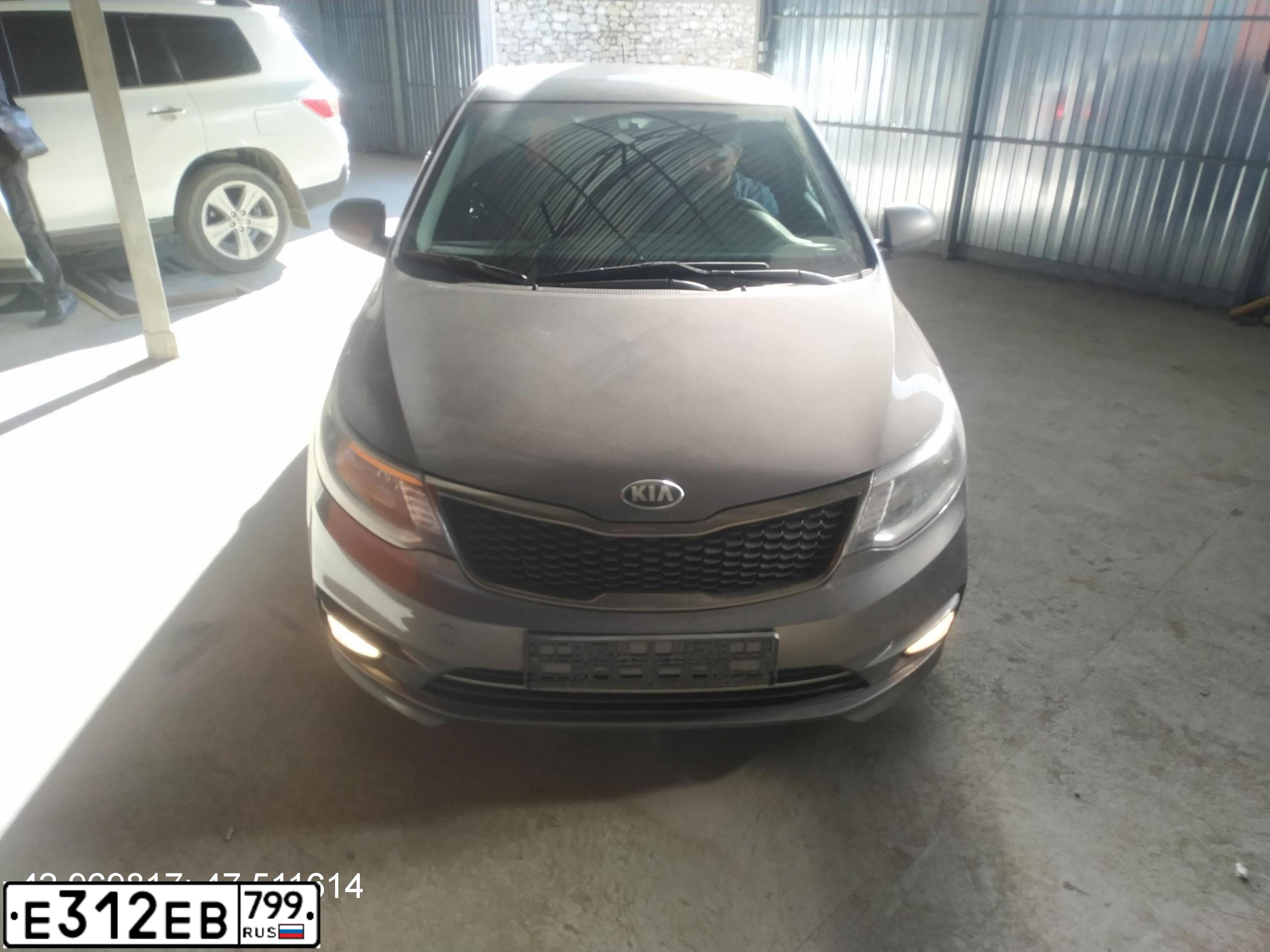 Фото автомобиля KIA RIO, 2016 — госномер Т844КН05. Цвет: СЕРЫЙ